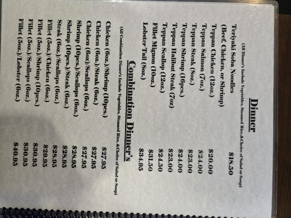 Restaurant menu featuring tempura and rolls.